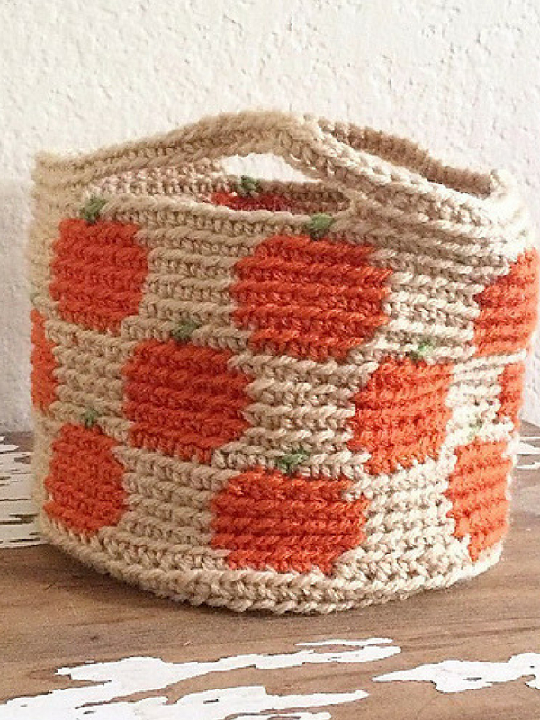 A crocheted pumpkin basket.