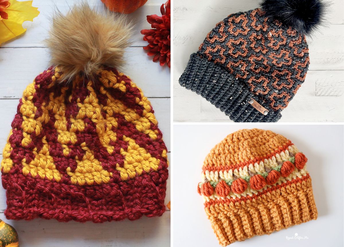 Three crochet beanies: one with a red and yellow pattern, one gray with orange patterns and a black pom-pom, and one orange with pom-pom bands. Placed on a white surface with autumn decor.