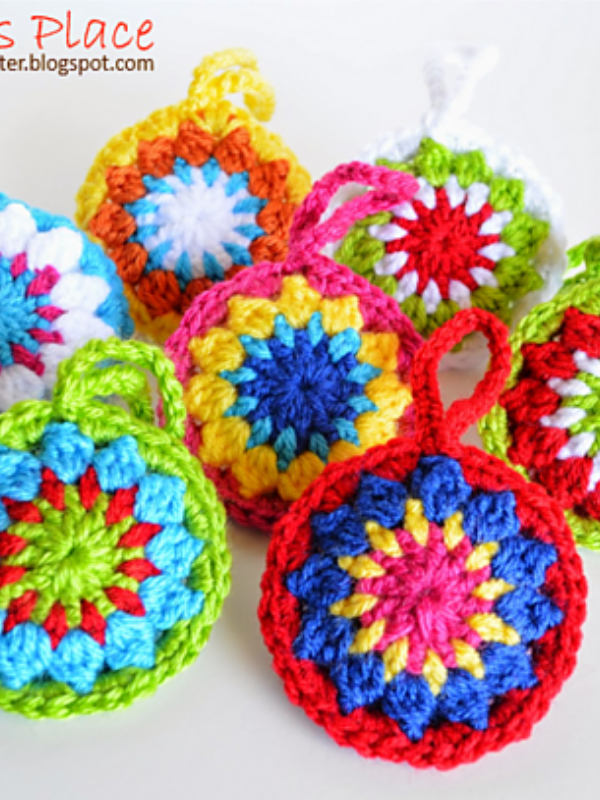 Crocheted ornaments in a variety of festive colors.