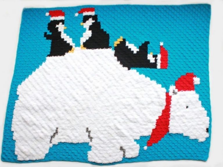 A winter-themed crocheted blanket featuring two polar bears.