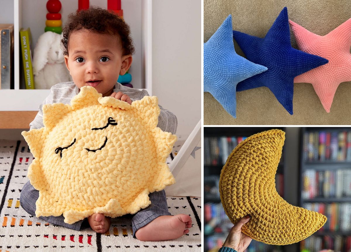 A baby holds a crocheted sun pillow. To the right, there are three star plushies in blue and pink, and a hand holds a crocheted yellow crescent moon pillow.