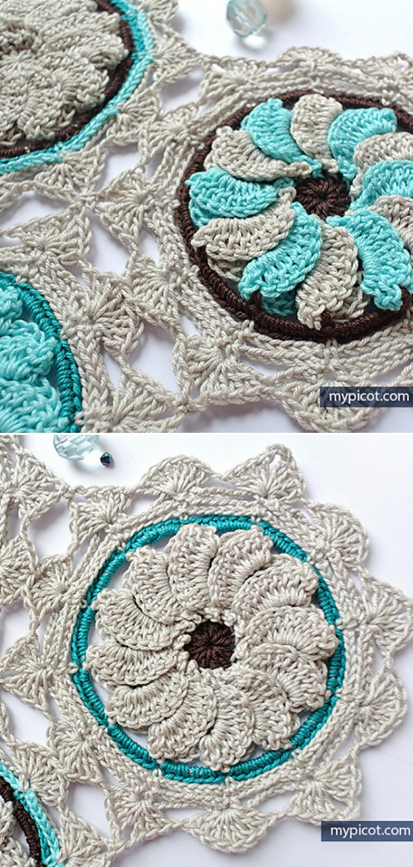 A crocheted doily with blue and white flowers.