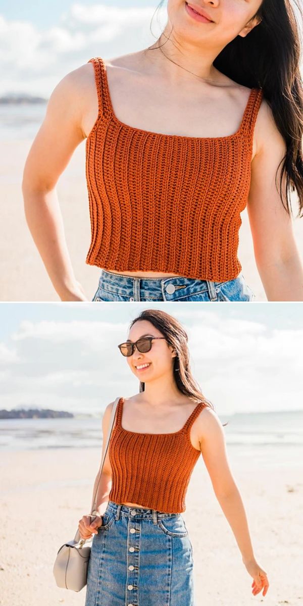 A person at the beach wears an orange crochet crop top and a blue denim skirt, carrying a light-colored shoulder bag and wearing sunglasses.