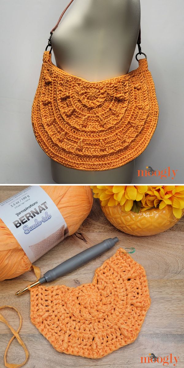 A crocheted Half Moon Shawl made with yarn and a crochet hook.