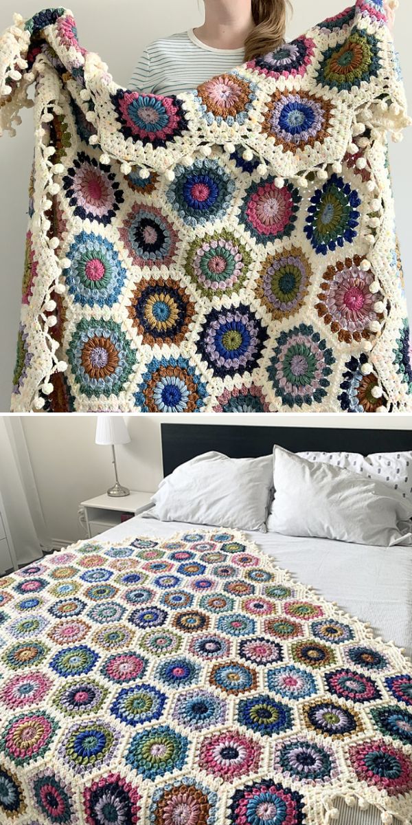 A multicolored crochet star blanket with circular patterns and cream borders is shown being held up and spread out on a bed.