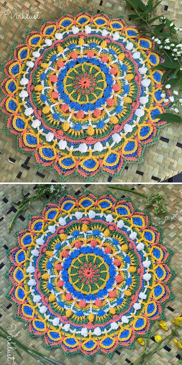 A colorful, round crochet mandala with intricate patterns in blue, yellow, green, orange, and white is displayed on a woven mat with small green branches nearby—perfect inspiration for your next square blanket knitting project.