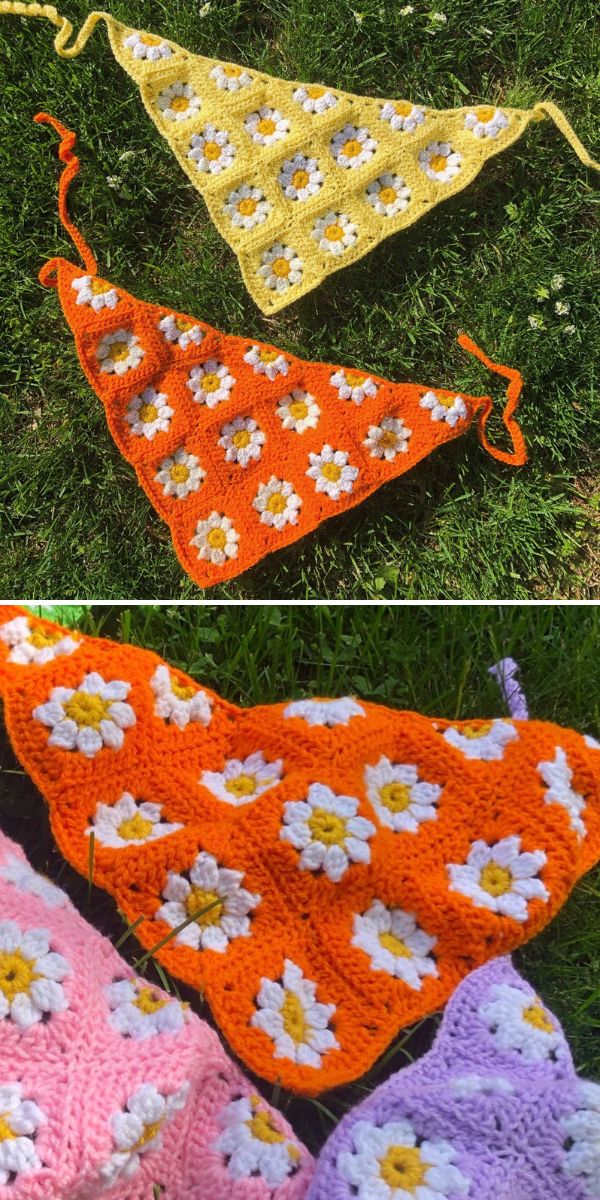 Two crochet triangle bandanas featuring daisy flower motifs in yellow and orange color schemes, displayed on grass.