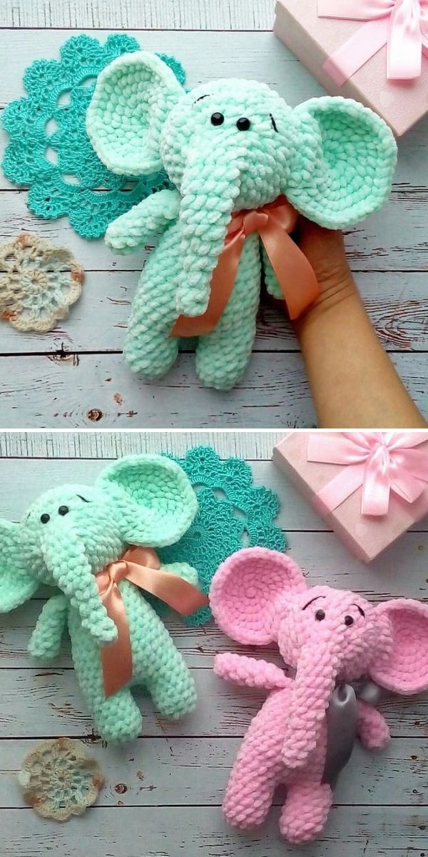Two handmade plush elephant toys, one mint green with a peach ribbon and one pink with a gray ribbon, are displayed on a wooden surface with decorative items and a pink gift box.
