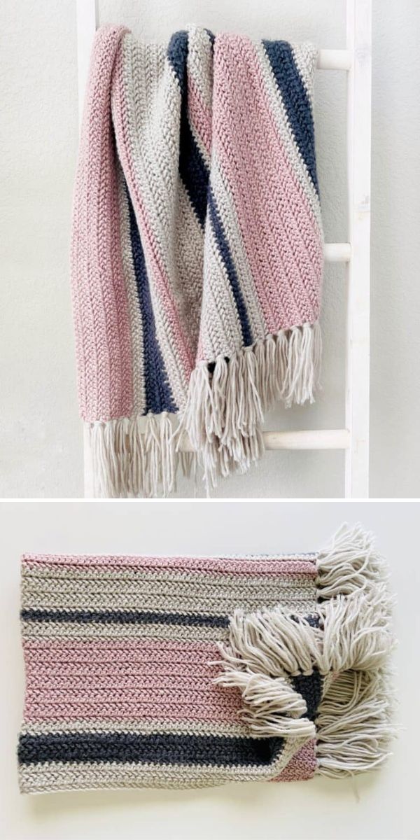 striped pastel crochet baby blanket on a ladder