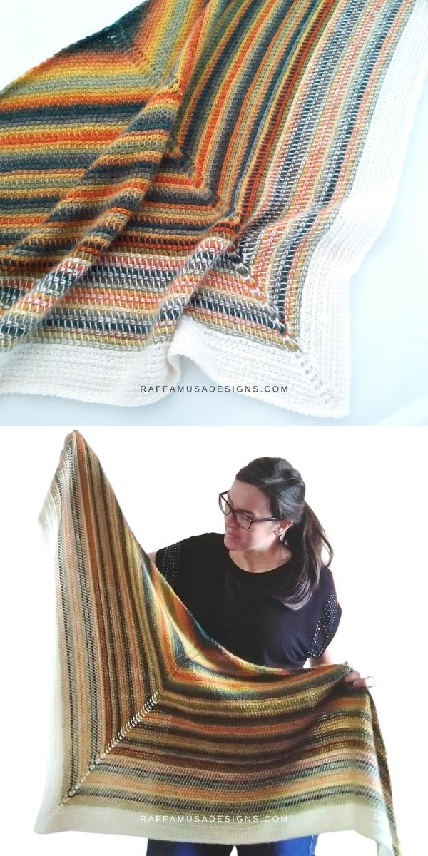 A woman is holding up a striped tunisian crochet shawl.