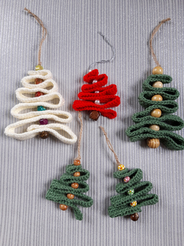 A group of christmas tree ornaments on a gray background.