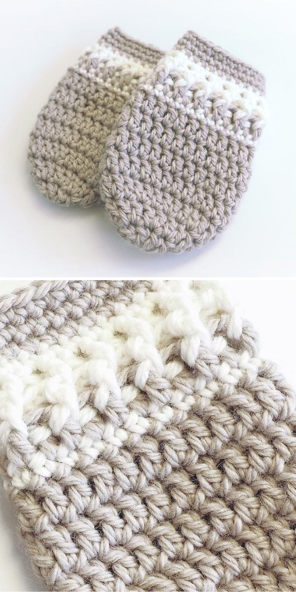 A pair of crocheted mittens on a table.