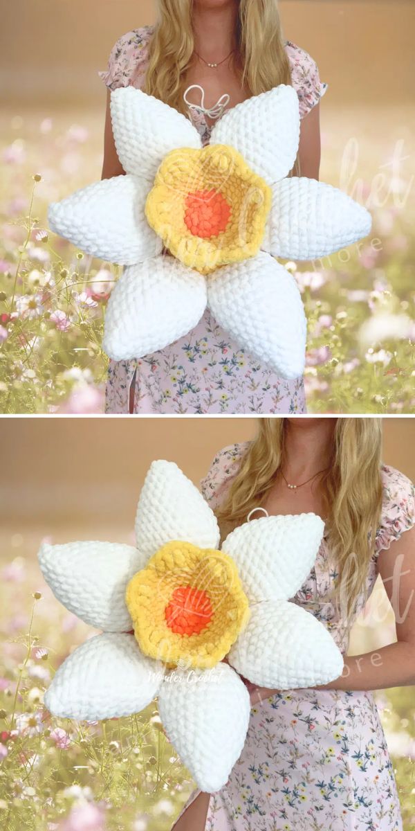 A woman is holding a white flower in her hands.
