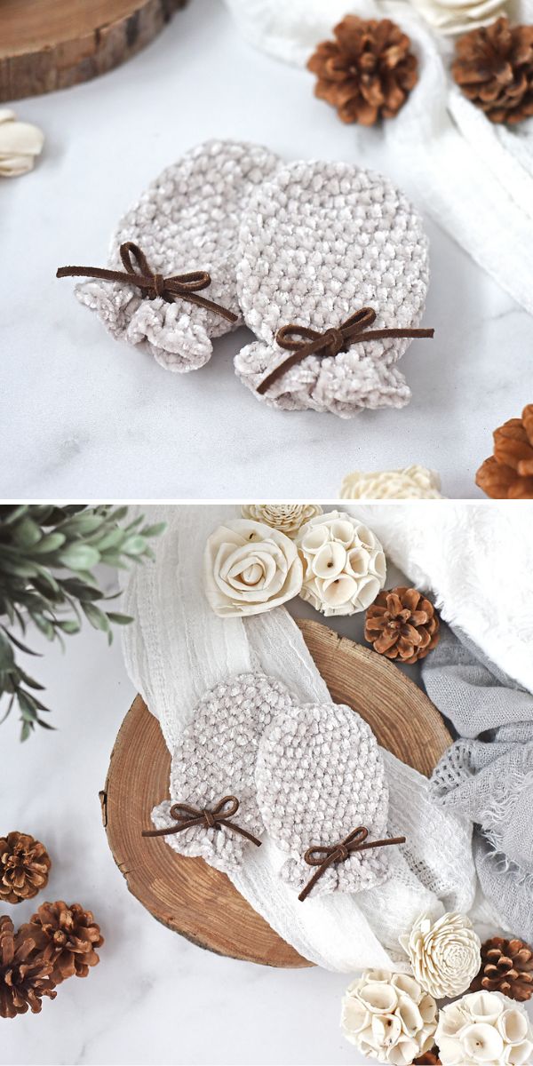 Mittens with bows and pine cones on a table.