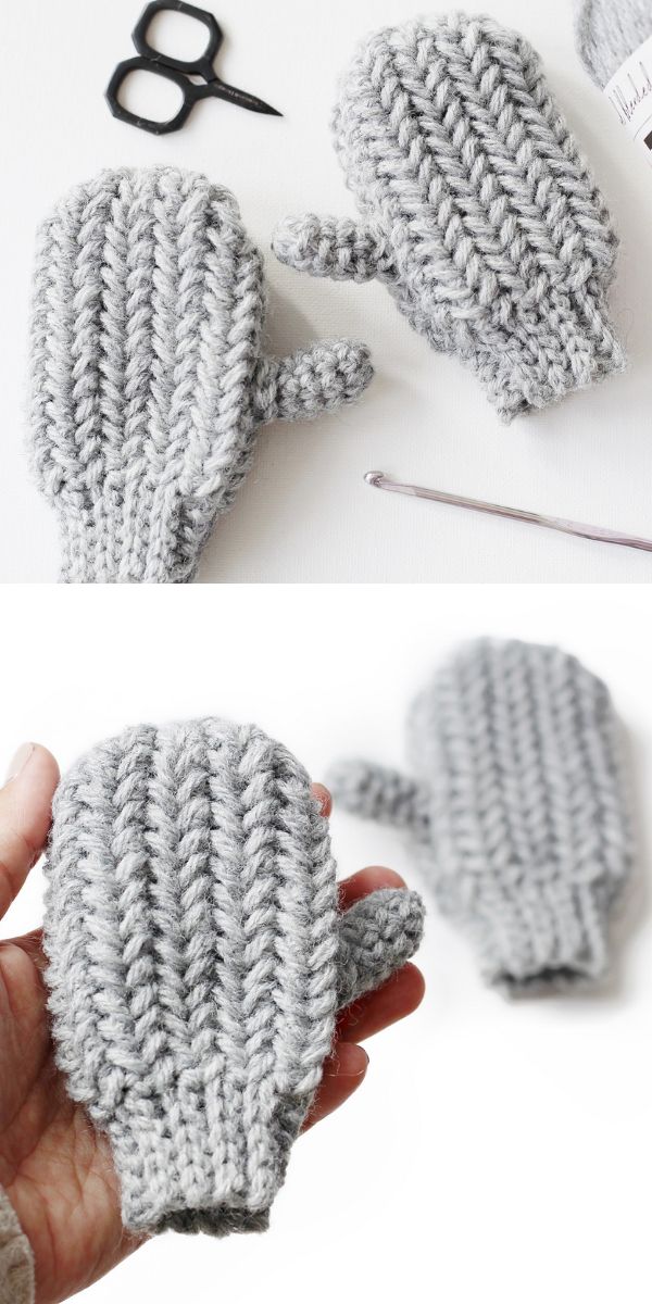 Crocheted mittens with scissors and knitting needles.