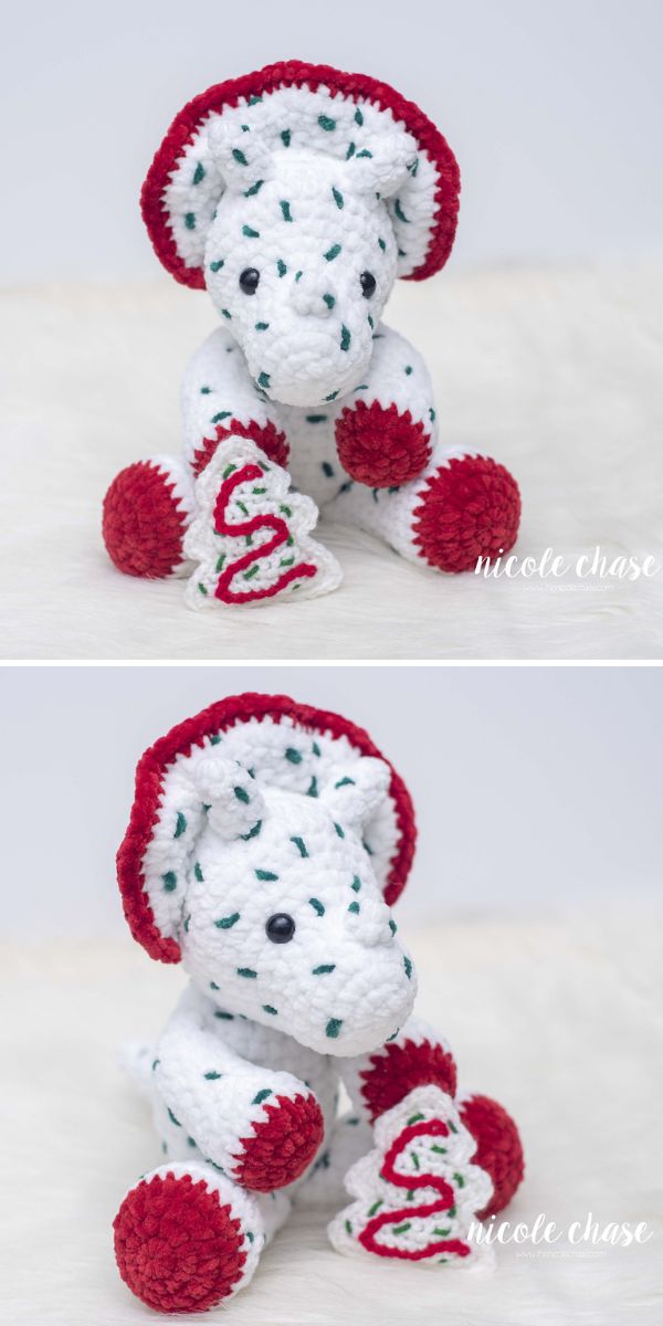 A crocheted dinosaur amigurumi with a red and white hat.
