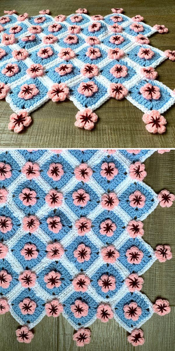 A crocheted afghan with blue and pink flowers.
