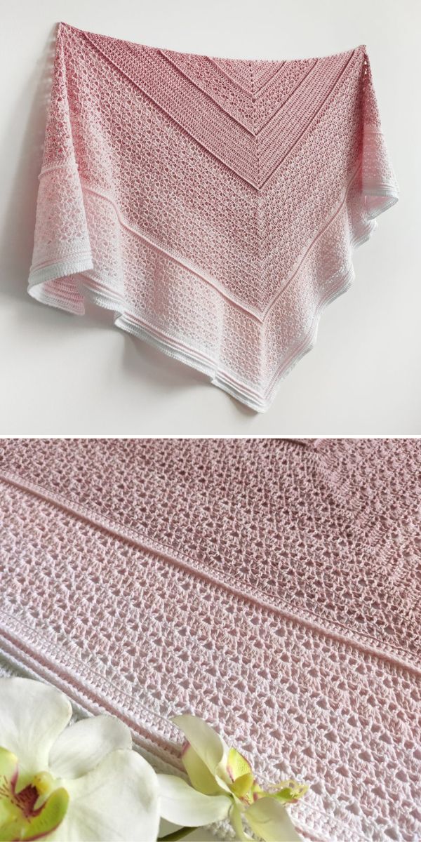 a crocheted lace shawl in pink shades