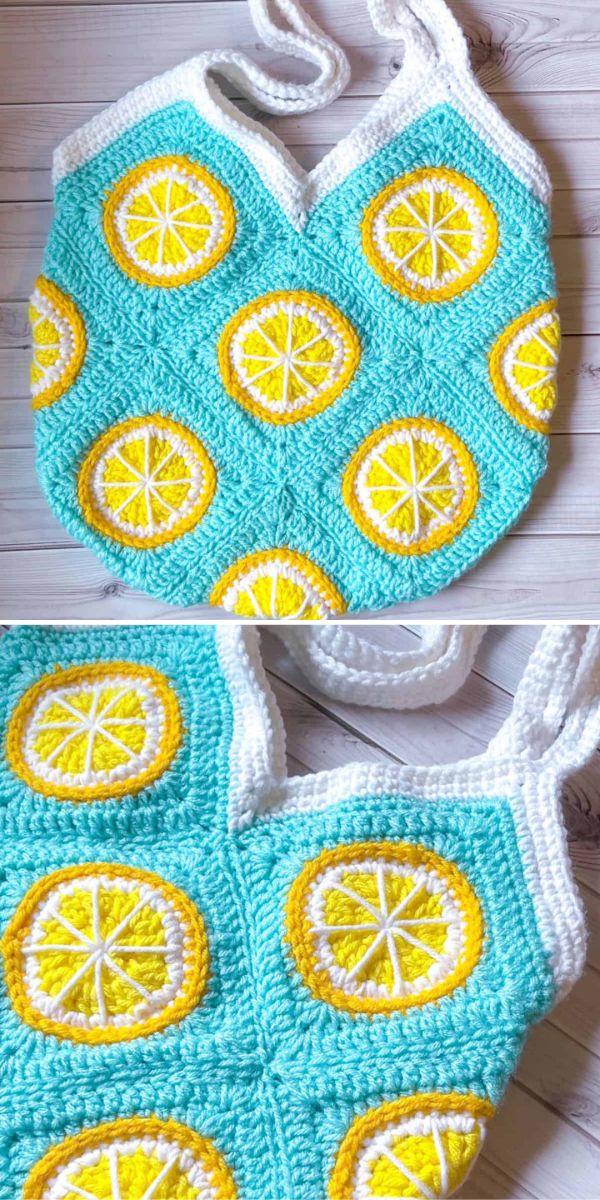 A handmade crochet tote bag with a light blue base and white handles, adorned with yellow and white appliques resembling slices of citrus fruits.