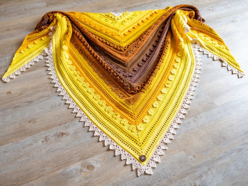 a beautiful crochet shawl with an intricate design