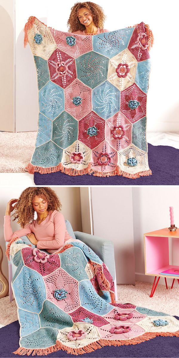 a crochet blanket made of hexagons with flower embelishments