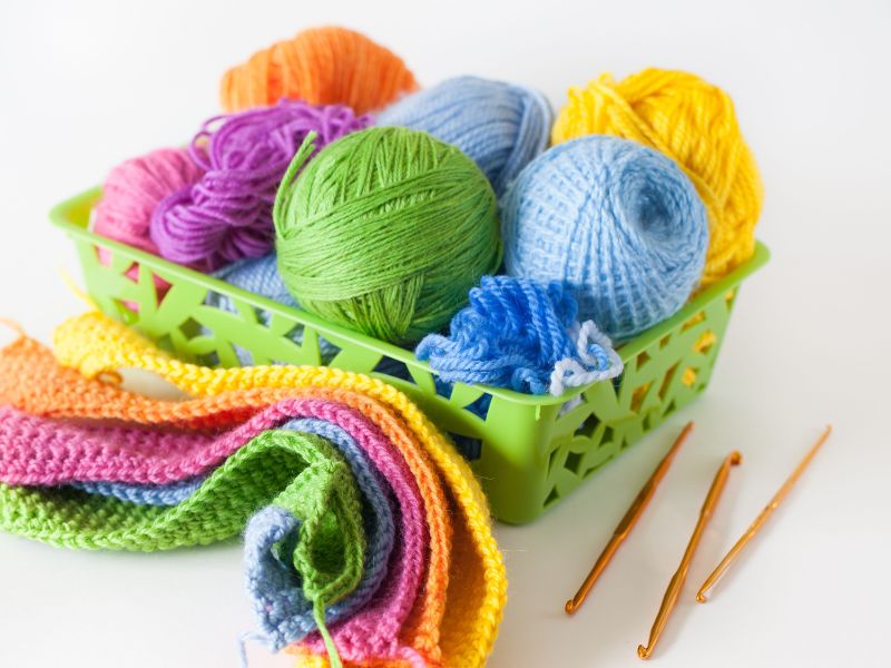 a plastic basket with yarn