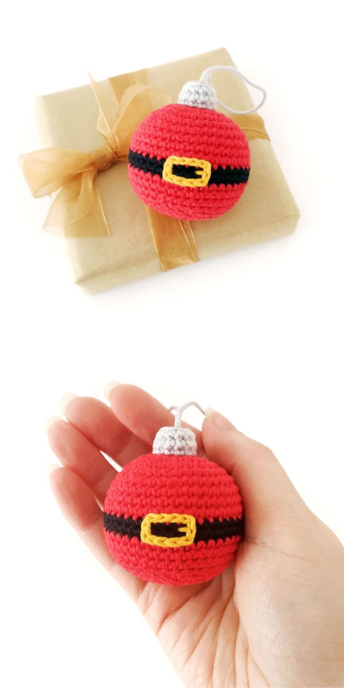 A hand holds a crochet Christmas ornament resembling Santa's belt, lying on a gift-wrapped package with a brown ribbon.