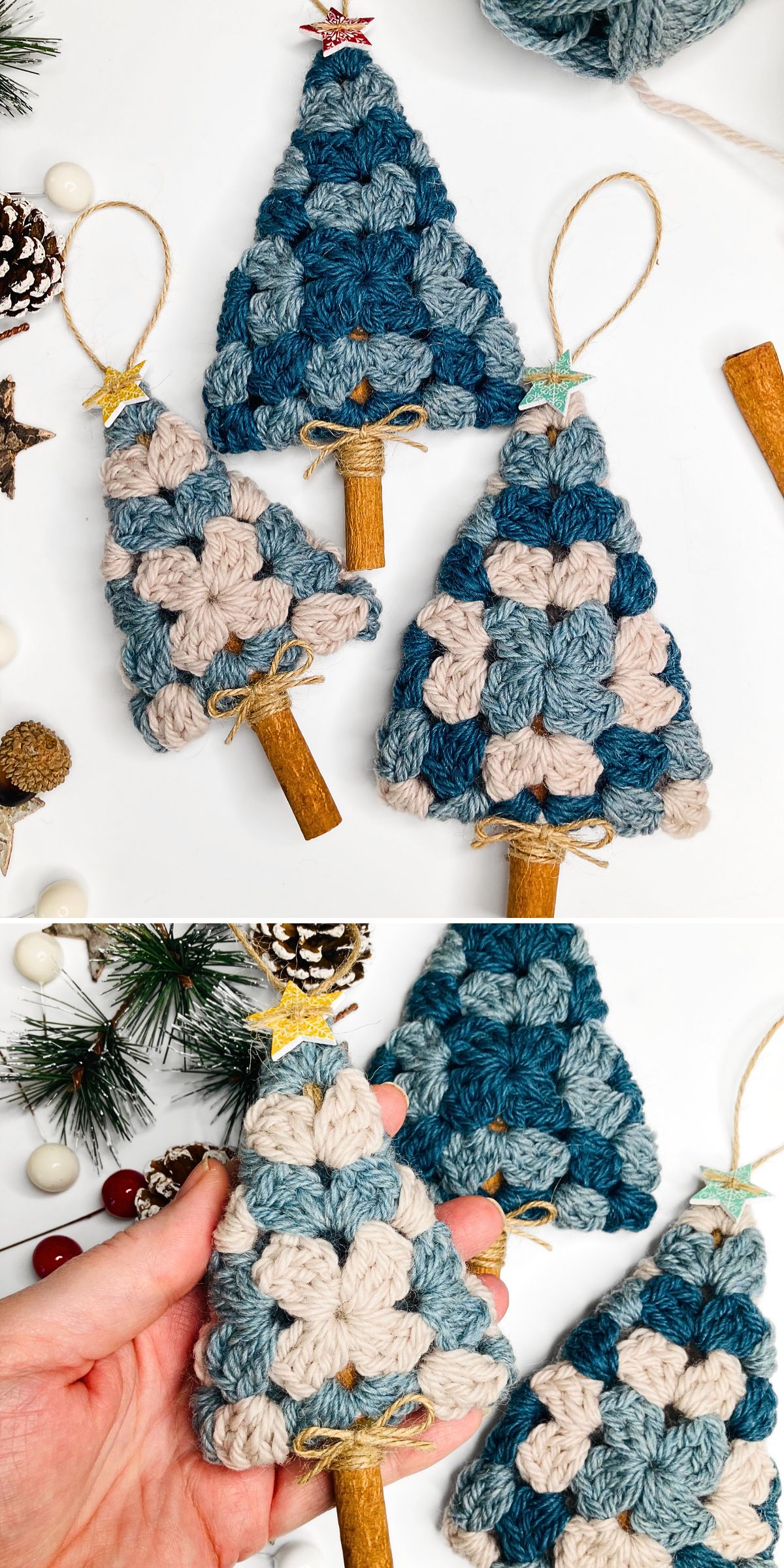 Hand holding crochet tree ornaments with cinnamon stick trunks, featuring blue and white patterns, on a white surface with decorative items.