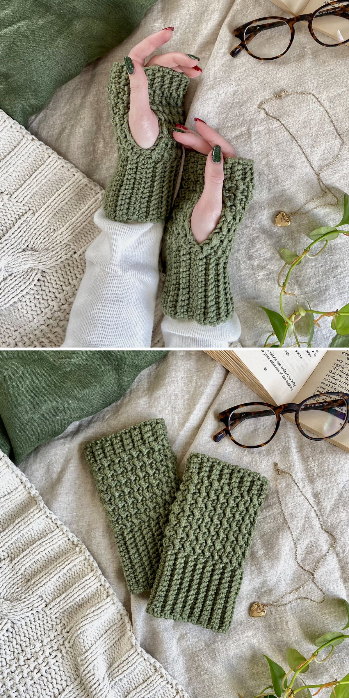 A pair of green crochet fingerless gloves, displayed with a book, glasses, necklace, and plants on a textured fabric surface.