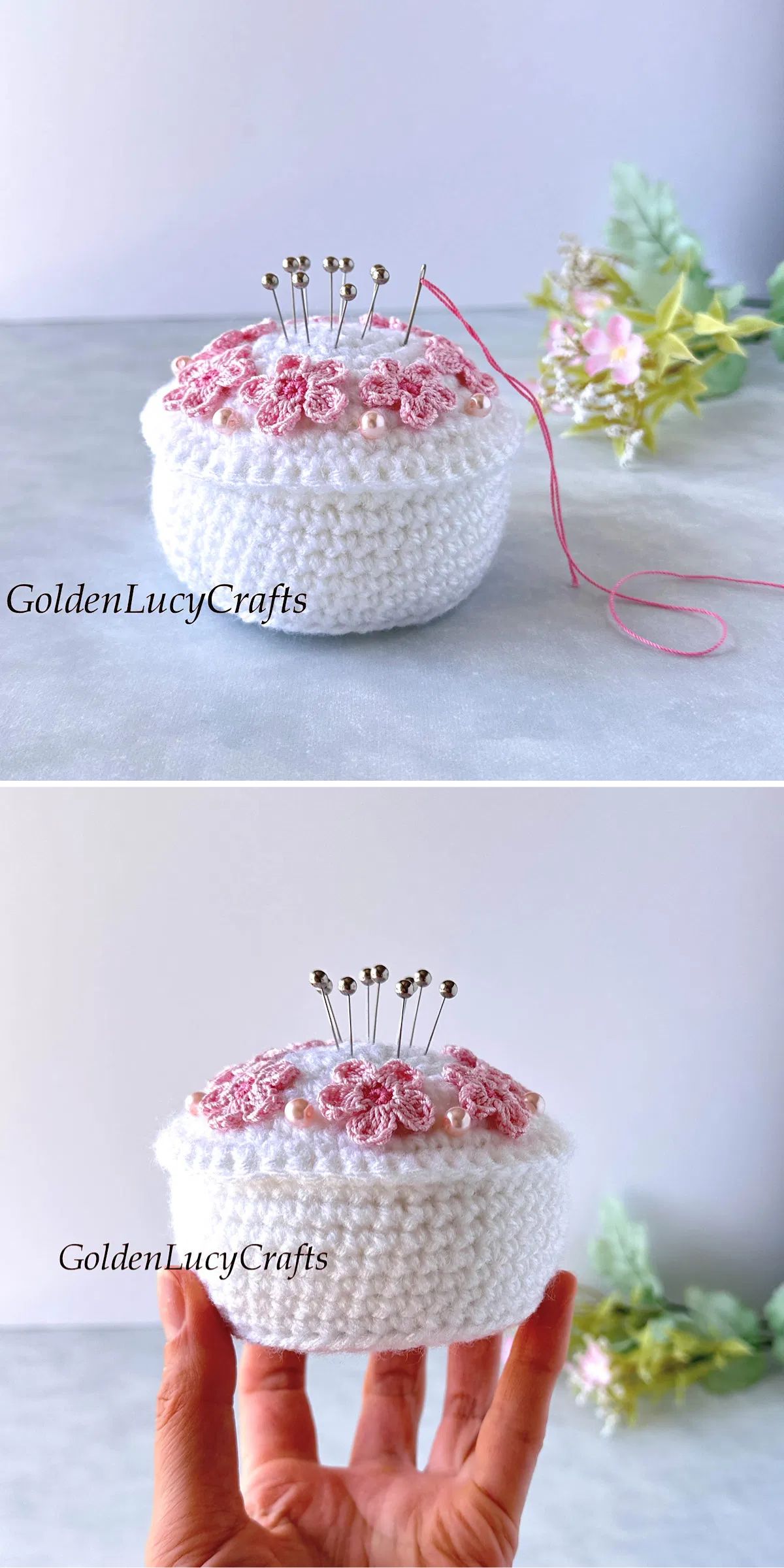 a white cupcake-like crochet pincushion adorned with small flower appliques