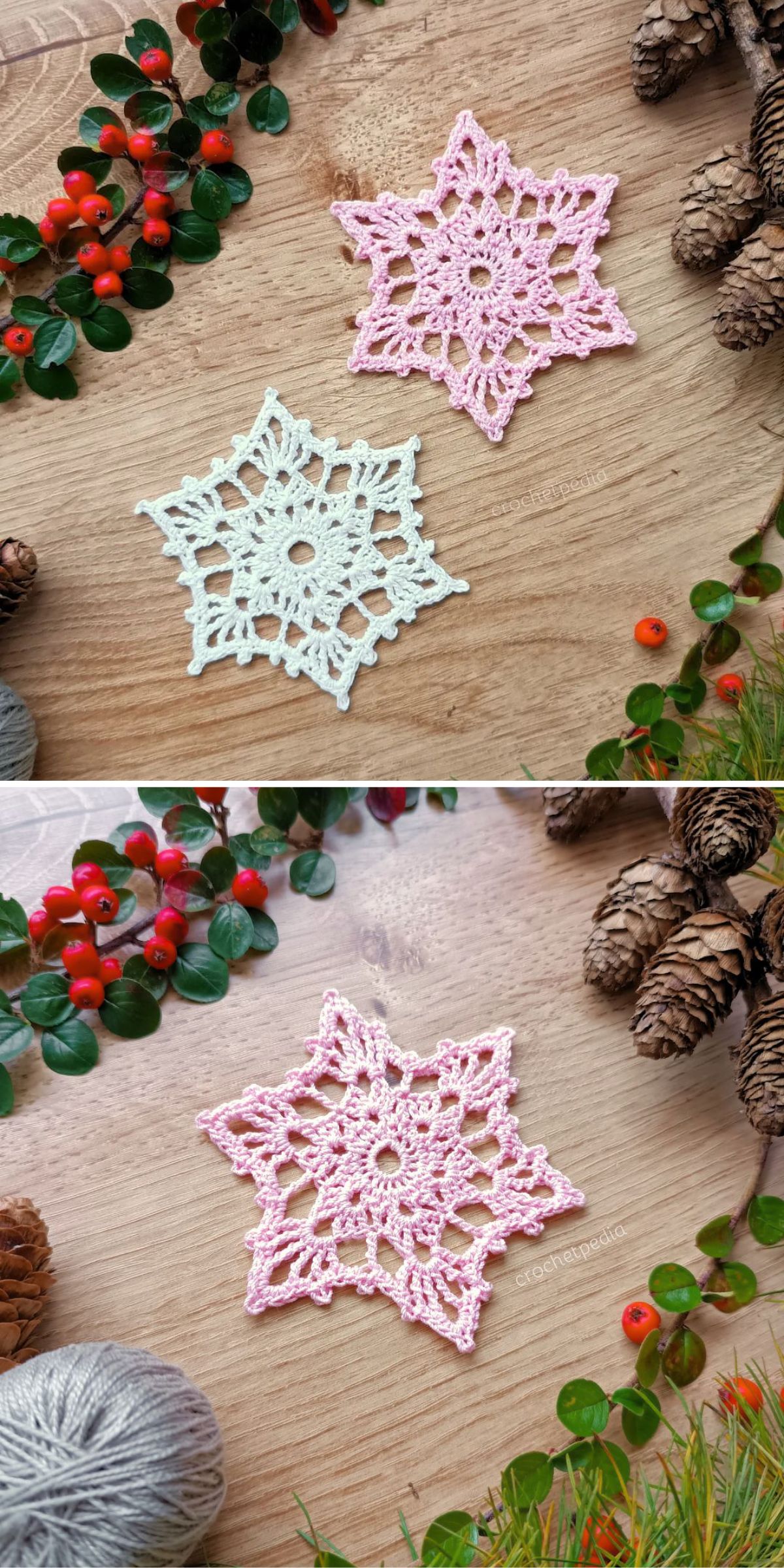 Two crochet snowflake ornaments, one white and one pink, are displayed on a wooden surface with pinecones, berries, and yarn nearby.