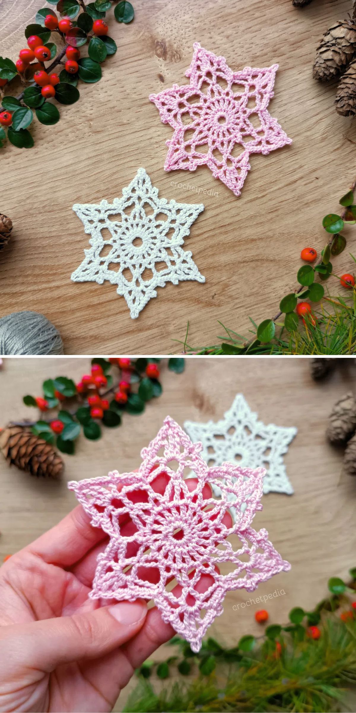 Two crocheted star-shaped ornaments, one pink and one white, are displayed on a wooden surface with greenery, pinecones, and red berries. One ornament is shown held in a hand.