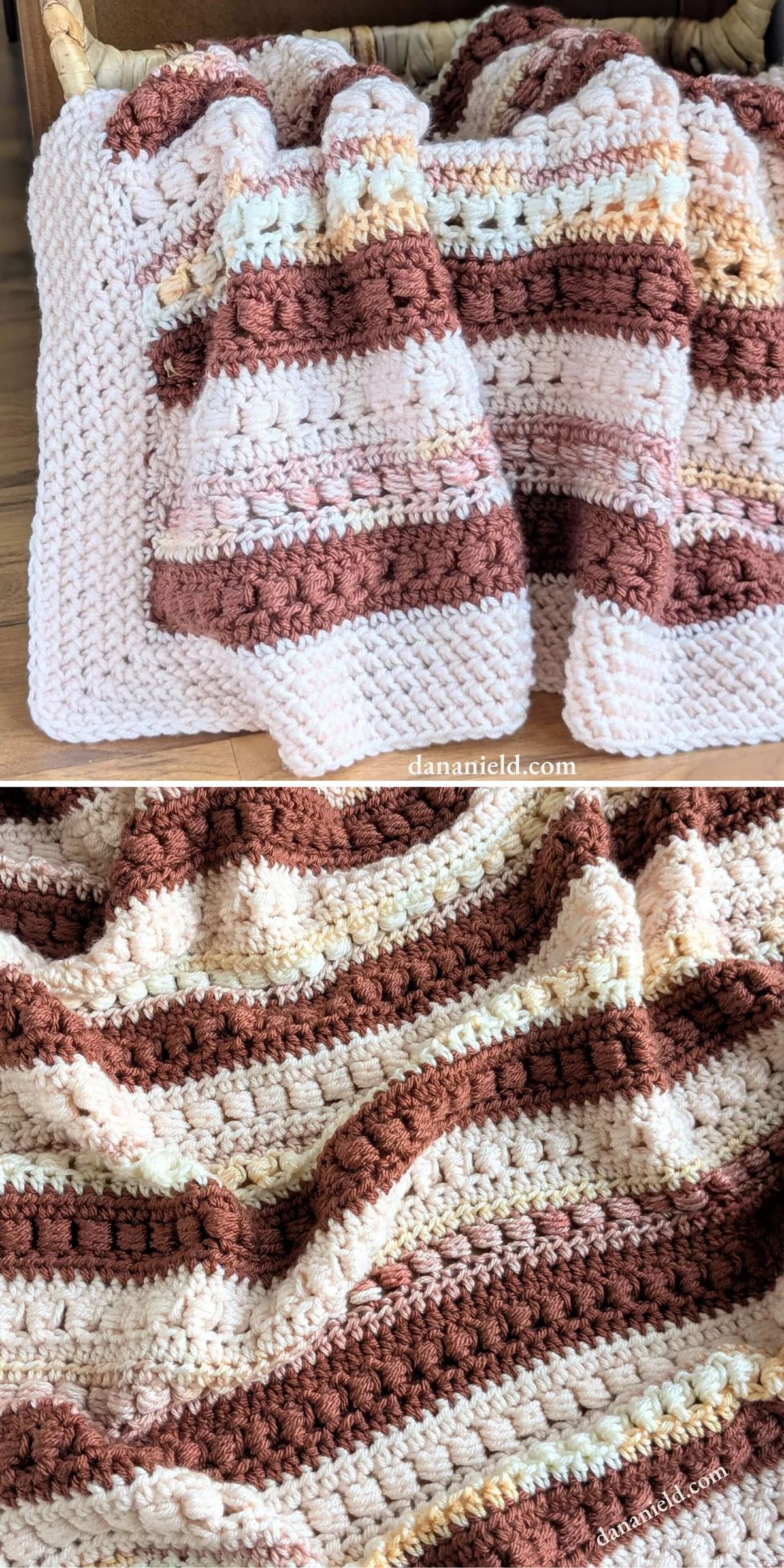 A crocheted blanket with alternating cream, beige, and brown stripes draped over a surface, showing textured stitches and soft yarn.