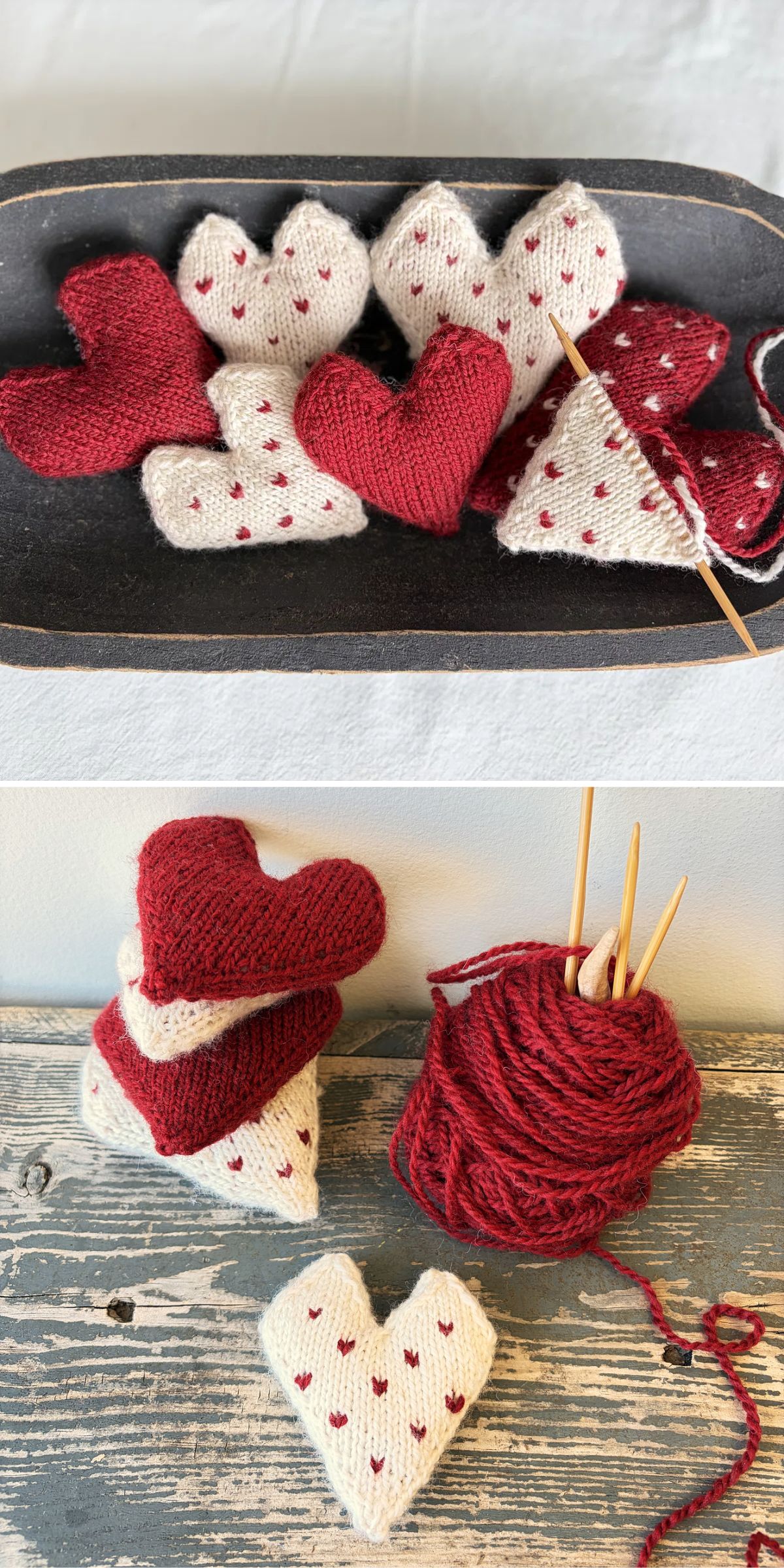 A collection of red and white knitted heart shapes, some with small red dots, displayed in a tray and stacked near red yarn and knitting needles on a wooden surface.