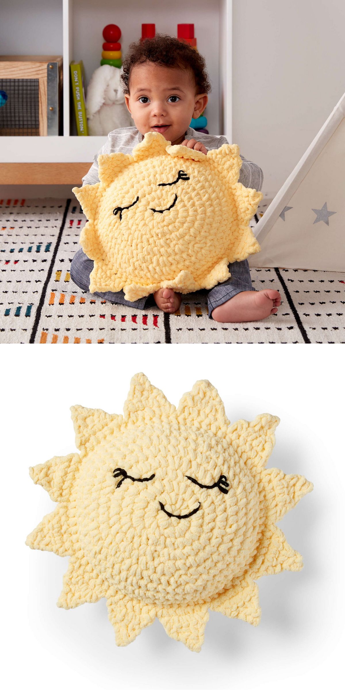 A young child sits on a patterned rug holding a plush yellow sun pillow with a smiling face; the pillow is also shown alone on a white background.