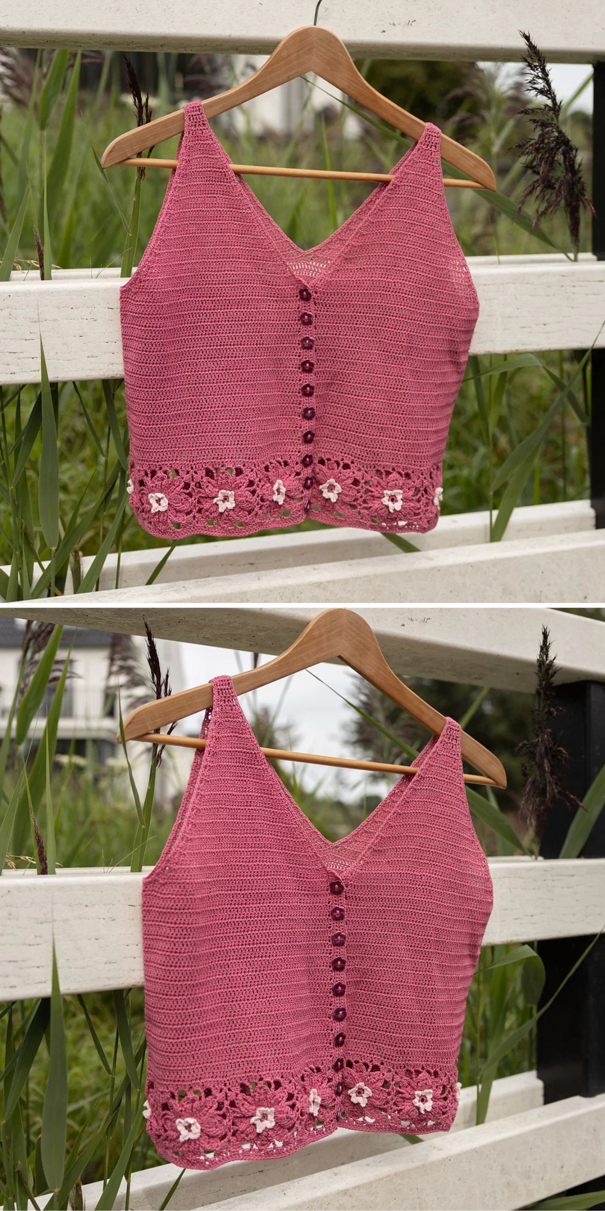 A sleeveless pink crochet top hangs on a wooden hanger, featuring front buttons and a floral lace hem, displayed outdoors on a white fence with greenery in the background.