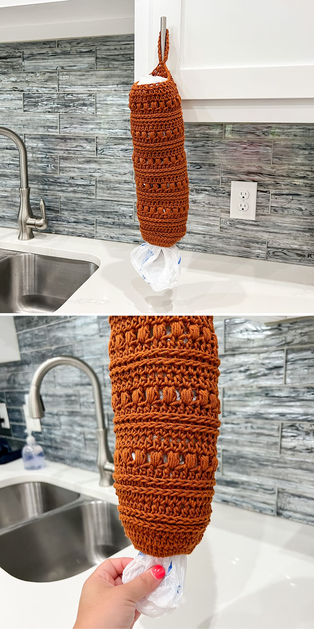 A hand pulls a plastic bag from a brown crocheted bag holder hanging on a white kitchen cabinet near a sink.