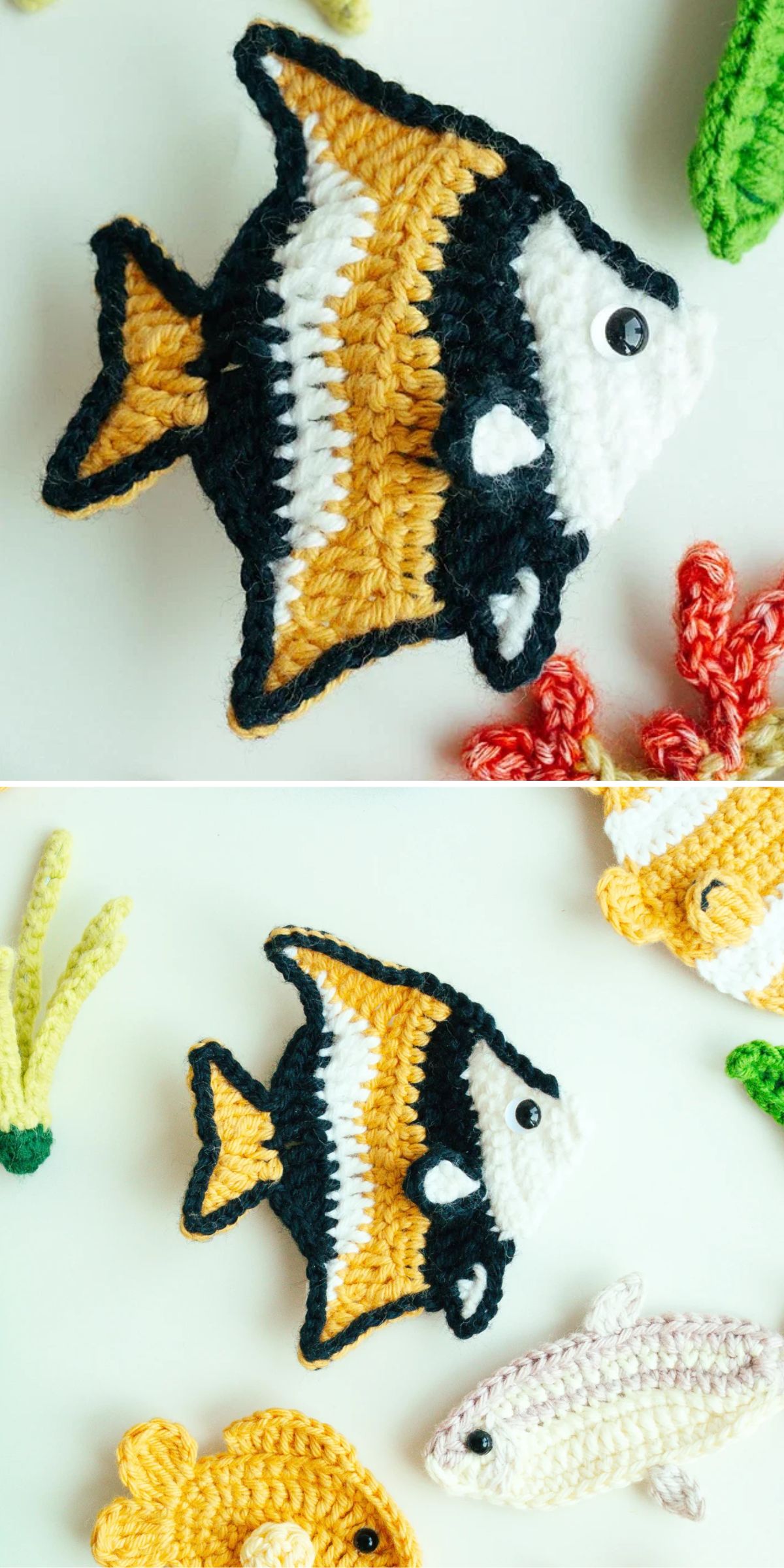 Two crocheted fish in black, white, and yellow yarn are displayed on a white surface beside other crocheted sea creatures and plants.
