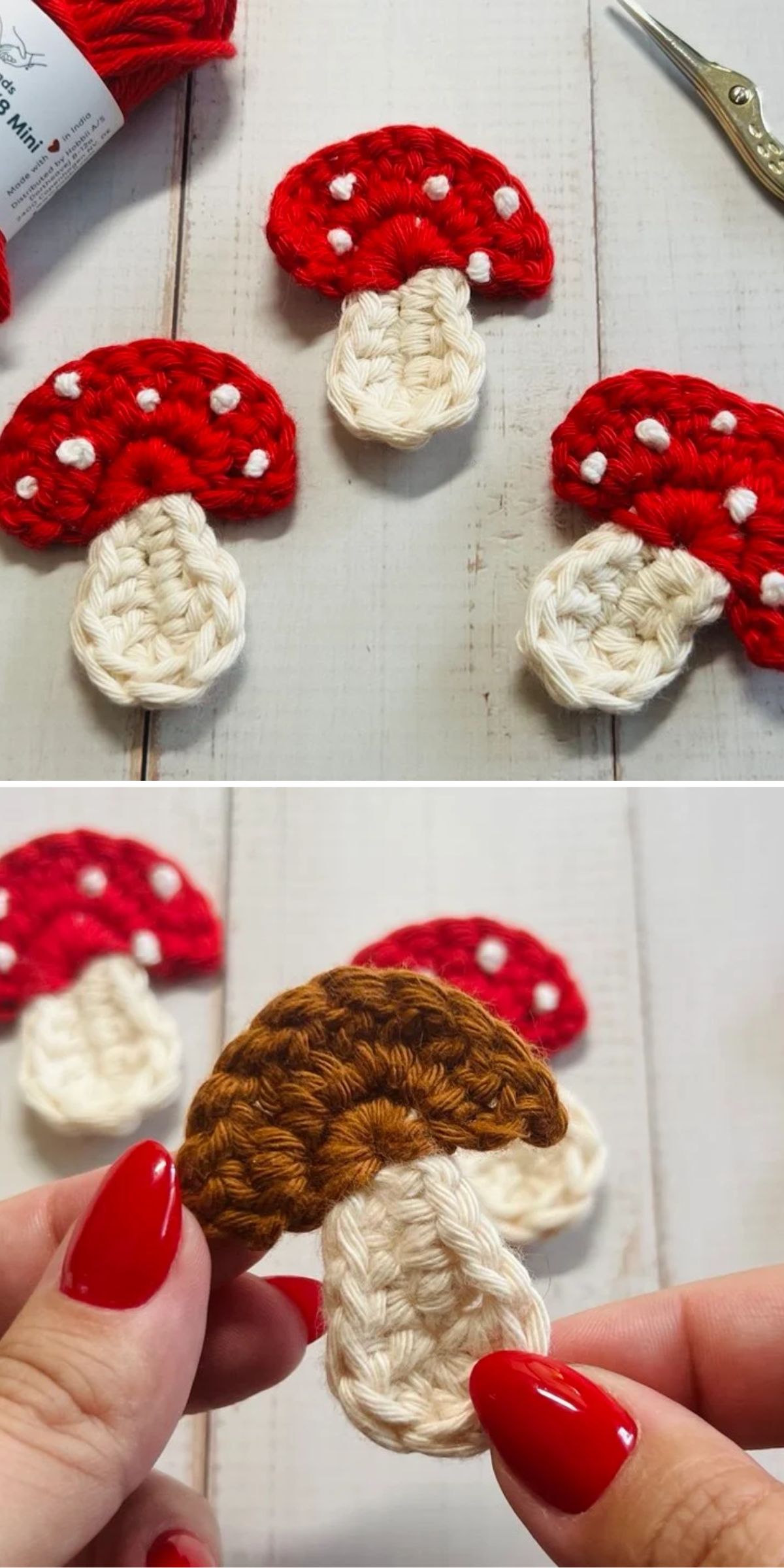 Crocheted mushroom appliqués in red with white spots and one brown, displayed on a light wooden surface. A hand holds the brown mushroom in the lower part of the image.